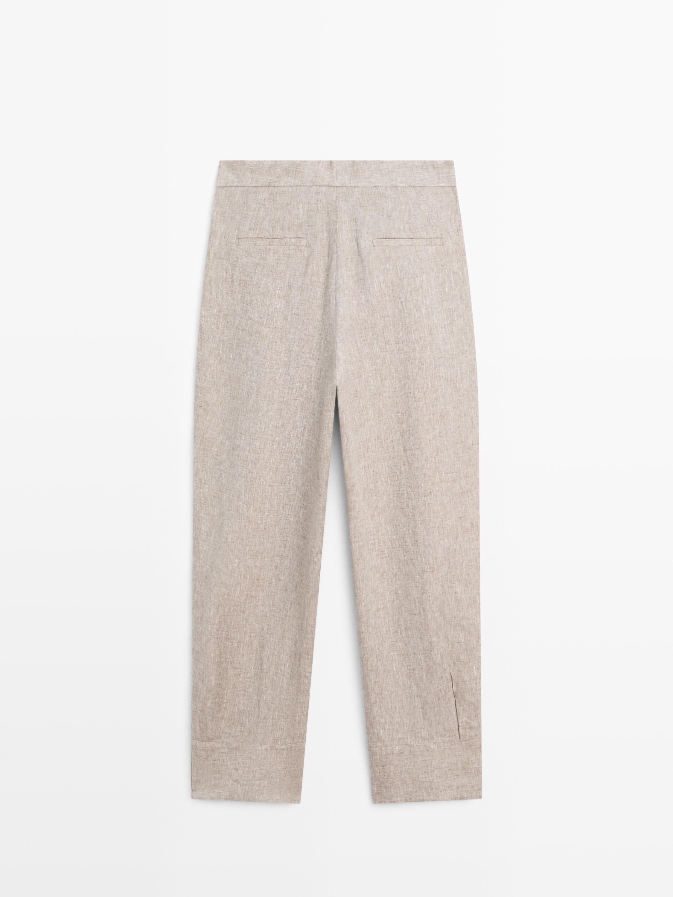 Suit trousers with buckle detail